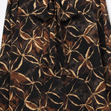 Q2 Black chiffon shirt with abstract print and knotted bow