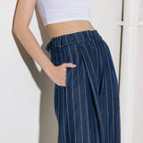 Hold Joy  in  indigo  trousers, by Flying Tomato