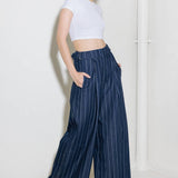 Hold Joy  in  indigo  trousers, by Flying Tomato